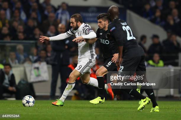 Juventus' forward Gonzalo Higuain from Argentina tries to escape FC Porto's midfielder Ruben Neves from Portugal during the match between FC Porto v...