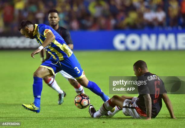 Sidcley of Brazil's Atletico Paranaense struggles for the ball with Gustavo Noguera of Paraguay's Deportivo Capiata during their Libertadores Cup...