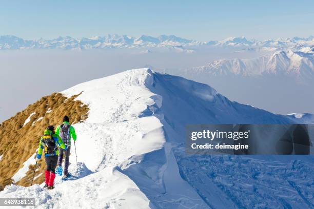 mountaineers on the mountain ridge - snowshoe stock pictures, royalty-free photos & images