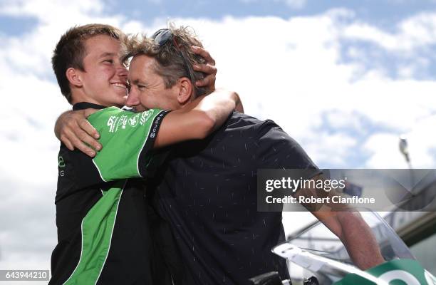 Oli Bayliss rider of the Kawasaki Ninja, poses with his father Troy Bayliss ahead of round one of the FIM World Superbike Championship at Phillip...