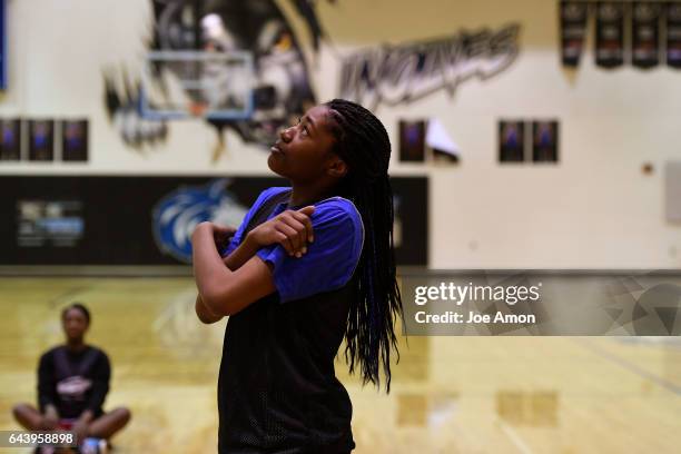 Grandview high school's Alisha Davis watching a ball bounce off the hoop before drills at the schools gym. February 22, 2017 Aurora, CO.
