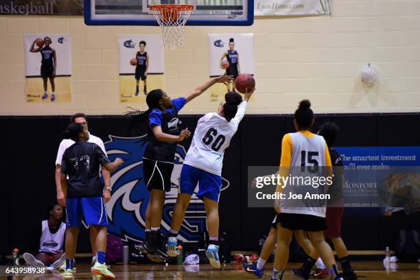 Grandview high school's Leilah Vigil shoots over teammate Alisha Davis during practice at the schools gym. February 22, 2017 Aurora, CO.