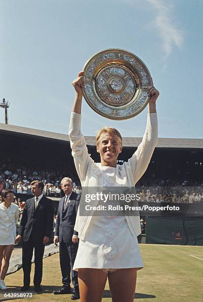 English tennis player Ann Jones holds up the Venus Rosewater Dish trophy after beating Billie Jean King of the United States 3-6, 6-3, 6-2 in the...