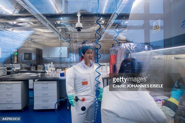 Chinese virologist Shi Zhengli is seen inside the P4 laboratory in Wuhan, capital of China's Hubei province on February 23, 2017. The P4...