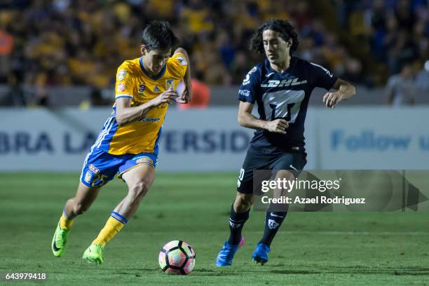 Jurgen Damm of Tigres fights for the ball with Matias Britos of Pumas during the quarterfinals first leg match between Tigres UANL and Pumas UNAM as...