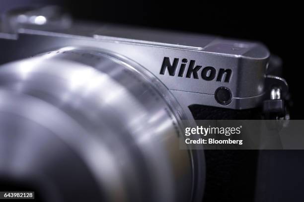 The Nikon Corp. Logo is displayed on the company's 1 J5 mirrorless digital camera at the CP+ Camera and Photo Imaging Show in Yokohama, Kanagawa,...