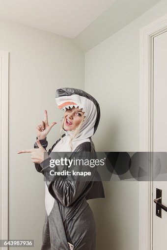 Playful woman in shark costume Playful woman in shark costume