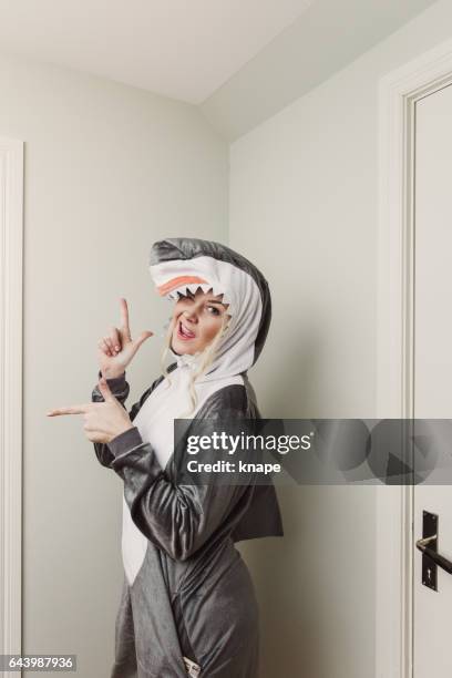 playful woman in shark costume - woman in funny costume stock pictures, royalty-free photos & images