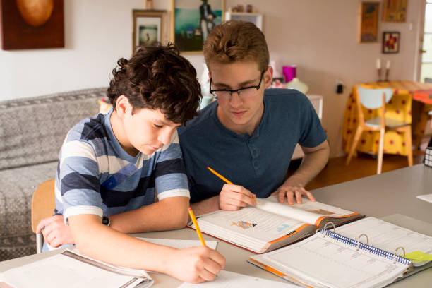 Homework 2000s 9,041 Boys 2000 Stock Photos, High-Res Pictures, and Images - Getty Images