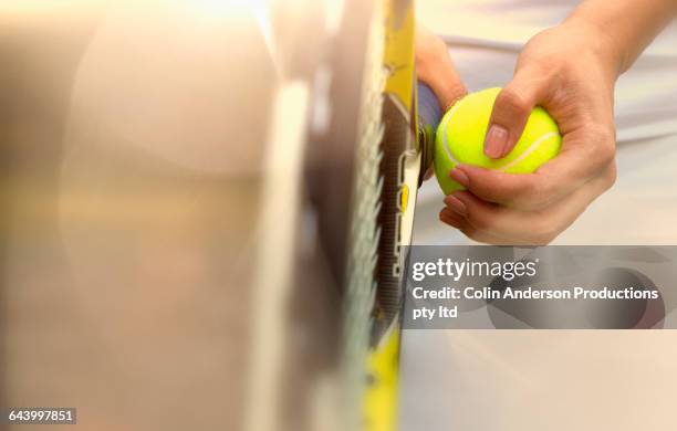 pacific islander woman holding tennis ball - tennis racquet 個照片及圖片檔