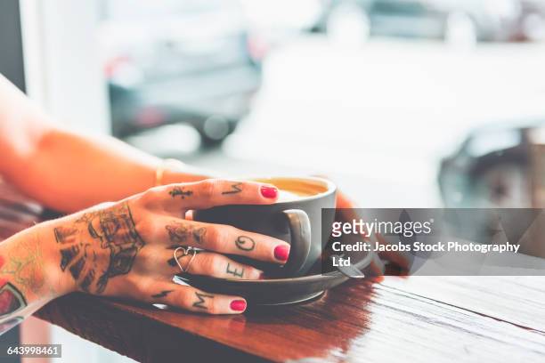 caucasian woman drinking coffee in cafe - melbourne cafe stock-fotos und bilder