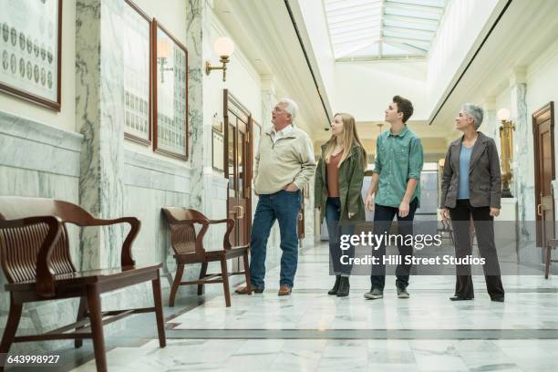 caucasian family touring courthouse - girl museum stockfoto's en -beelden