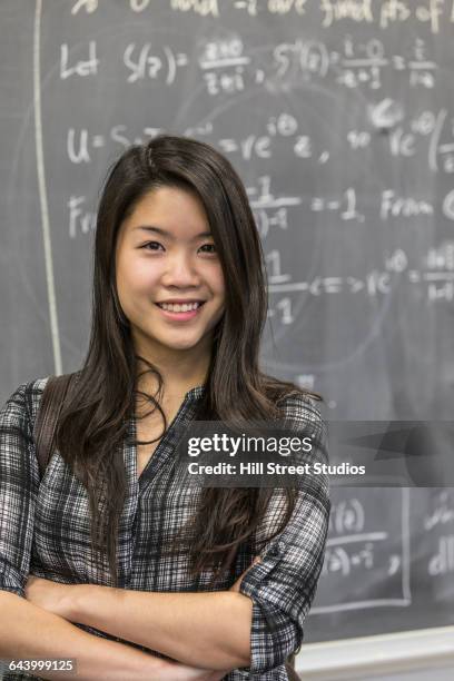 asian student smiling in college classroom - mathematiker stock-fotos und bilder