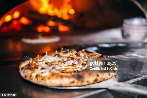 pizza cooking in wood fired oven - pizzaugn bildbanksfoton och bilder