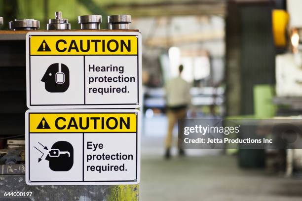 close up of safety signs in factory - seguridad y salud ocupacional fotografías e imágenes de stock