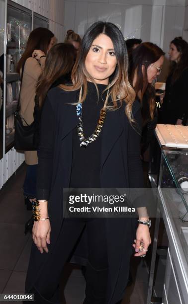 Guest tries on jewelry at Atelier Swarovski and Louise Roe Celebrate Awards Season At the Grove on February 22, 2017 in Los Angeles, California.
