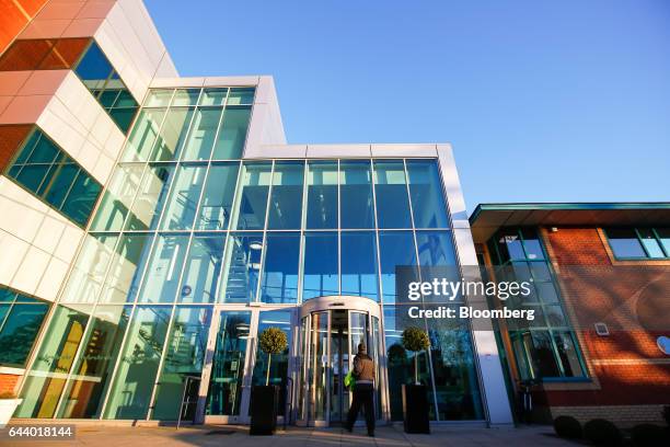 An employee enters the British American Tobacco Plc research and development laboratories in Southampton, U.K., on Wednesday, Jan. 18, 2017. BAT, the...