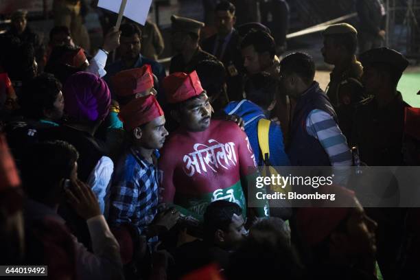 Supporter of the Samajwadi Party stands with the word "Akhilesh" painted on his chest in Hindi script, referring to Akhilesh Yadav, chief minister of...