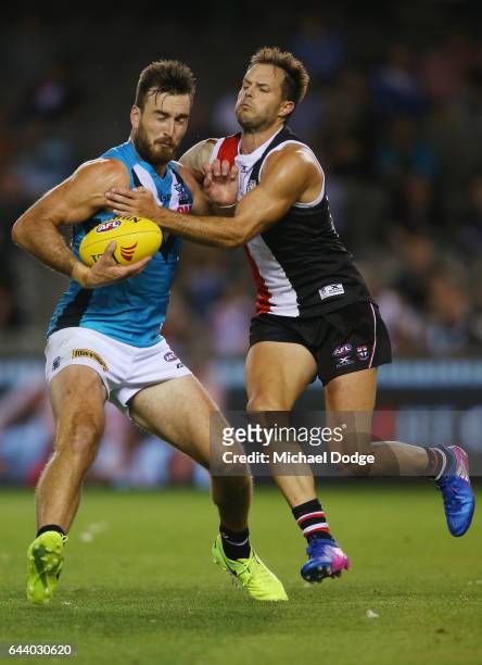 Charlie Dixon of the Power is tackled by Nathan Brown of the Saints during the JLT Community Series AFL match between the St Kilda Saints and the...