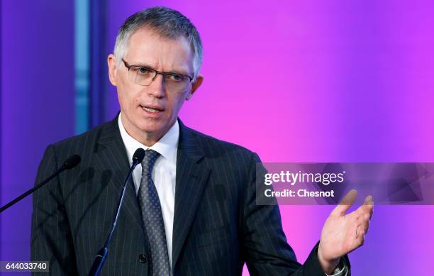 Chairman of managing board of French carmaker group PSA Peugeot Citroen, Carlos Tavares talks to the media during the presentation of the 2016 annual...