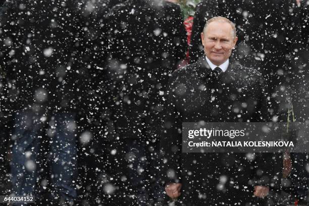 Russian President Vladimir Putin attends a wreath laying ceremony at the Tomb of the Unknown Soldier by the Kremlin wall to mark the Defender of the...