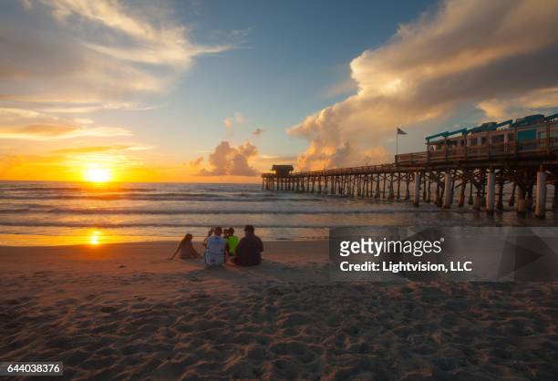 sunrise cocoa beach pier - beach florida family stockfoto's en -beelden