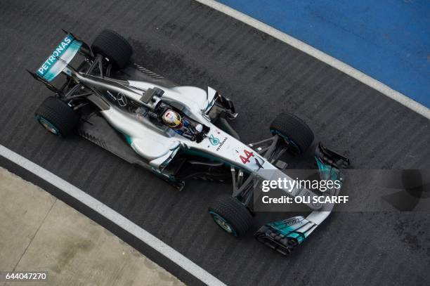 Mercedes AMG Petronas Formula One driver Lewis Hamilton drives during a launch event for the new 2017 season car at the Silverstone motor racing...