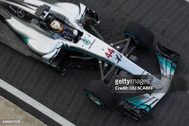 Mercedes AMG Petronas Formula One driver Lewis Hamilton drives during a launch event for the new 2017 season car at the Silverstone motor racing...
