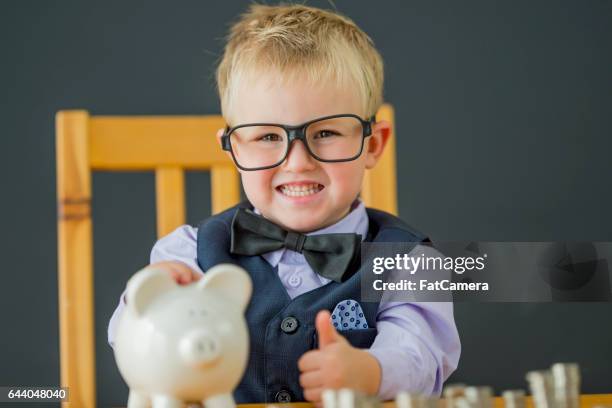 proud of his savings - kid making money stock pictures, royalty-free photos & images