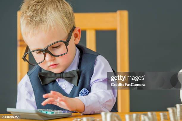 adding up his coins - canadian money stock pictures, royalty-free photos & images