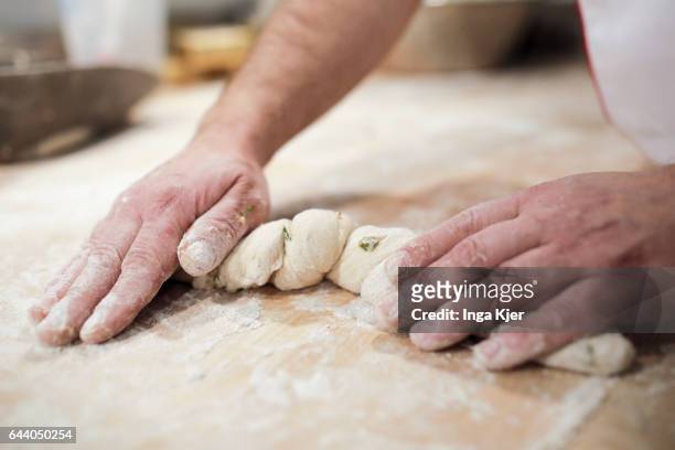 Berlin, Germany A baker kneads dough on February 06, 2017 in Berlin, Germany.