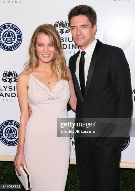 Ashley Hinshaw and Topher Grace attend The Art of Elysium presents Stevie Wonder's HEAVEN - Celebrating the 10th Anniversary at Red Studios on...