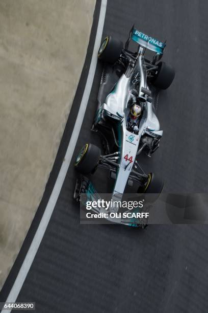 Mercedes AMG Petronas Formula One driver Lewis Hamilton drives during a launch event for the new 2017 season car at the Silverstone motor racing...