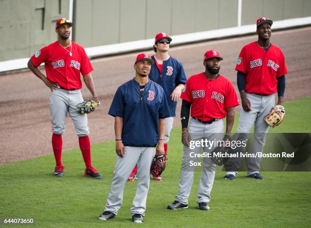 Boston Red Sox outfielders Chris Young, Mookie Betts, Andrew Benintendi, Jackie Bradley Jr. #19 and Junior Lake line up to participate in fielding...