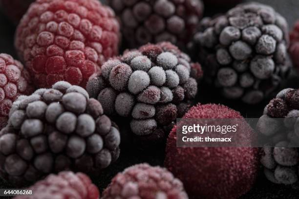 close-up to frozen berry fruit - frozen food stock pictures, royalty-free photos & images