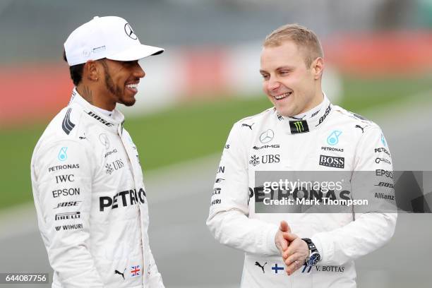 Lewis Hamilton of Great Britain and Mercedes GP shares a joke with Valtteri Bottas of Finland and Mercedes GP during the launch of the Mercedes...