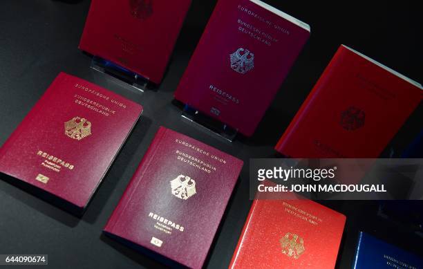 The new German electronic passport is presented during an official press conference on February 23, 2017 in Berlin. / AFP / John MACDOUGALL