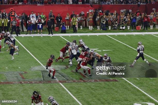 Quarterback Tom Brady of the New England Patriots in action on the Super Bowl LI Logo during the Super Bowl LI between the New England Patriots and...