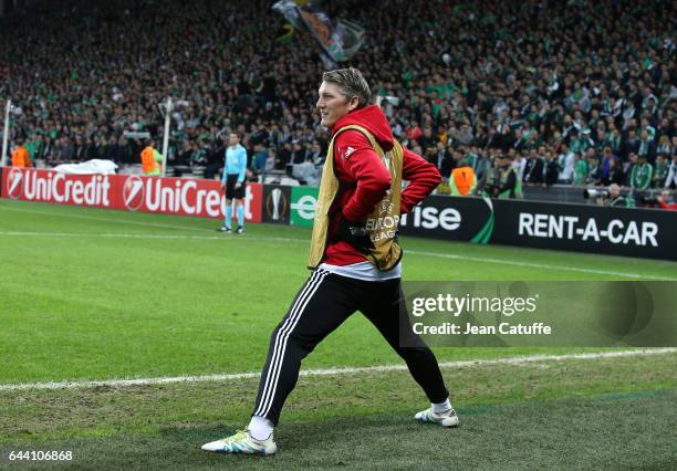 Bastian Schweinsteiger of Manchester United warms up during the UEFA Europa League Round of 32 second leg match between AS Saint-Etienne and...
