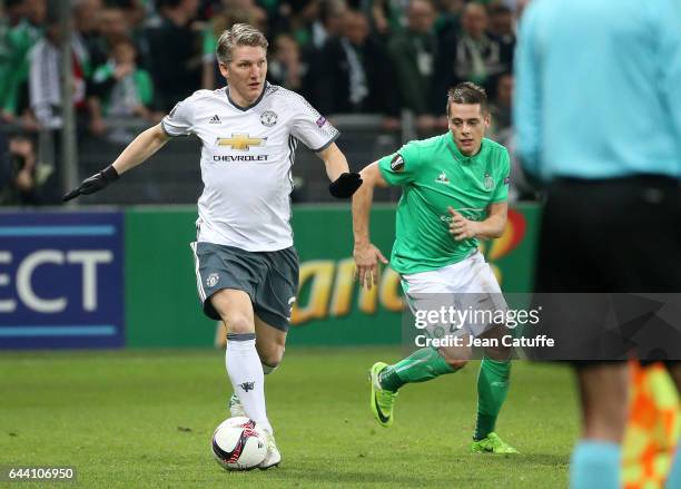 Bastian Schweinsteiger of Manchester United and Romain Hamouma of Saint-Etienne in action during the UEFA Europa League Round of 32 second leg match...