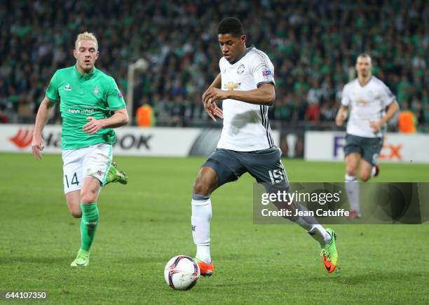 Marcus Rashford of Manchester United and Jordan Veretout of Saint-Etienne in action during the UEFA Europa League Round of 32 second leg match...