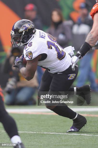 Terrance West of the Baltimore Ravens runs the football upfield during the game against the Cincinnati Bengals at Paul Brown Stadium on January 1,...