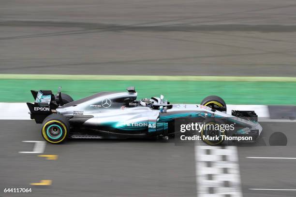 Valtteri Bottas of Finland and Mercedes GP drives during the launch of the Mercedes formula one team's 2017 car, the W08, at Silverstone Circuit on...