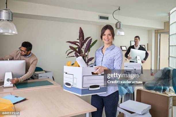 creative business people moving in new office - moving office stock pictures, royalty-free photos & images