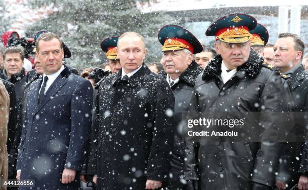 Russia's Prime Minister Dmitry Medvedev , Russia's President Vladimir Putin and Russia's Defense Minister Sergey Shoygu attend a wreath laying...