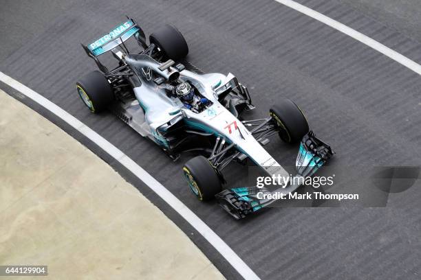 Valtteri Bottas of Finland and Mercedes GP drives during the launch of the Mercedes formula one team's 2017 car, the W08, at Silverstone Circuit on...