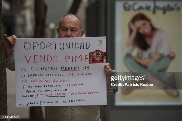 An Argentinian demonstrator protests for the lack of legal guarantees for small busines in Argentina during the "New Economy Forum" at the...
