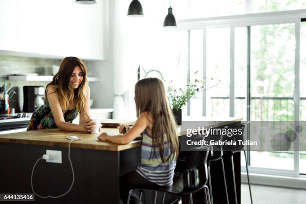 mother and daugther in their kitchen - cocina stock pictures, royalty-free photos & images