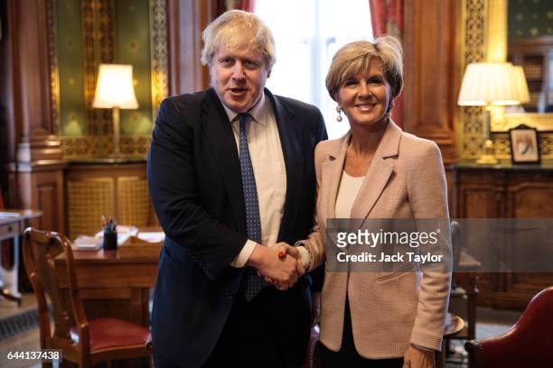 British Foreign Secretary Boris Johnson shakes hands with his Australian counterpart Foreign Minister Julie Bishop in his office at the Foreign and...