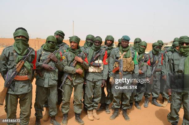 Malian army soldiers, pro-government militia members and former rebels, predominantly Tuaregs, take part in their first joint patrol in Gao in...